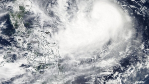Dozens of villages in the northern Philippines are facing threat from rising floodwaters triggered by Typhoon Koppu.